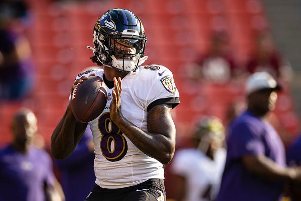 Lamar Jackson warms up before a Ravens game.