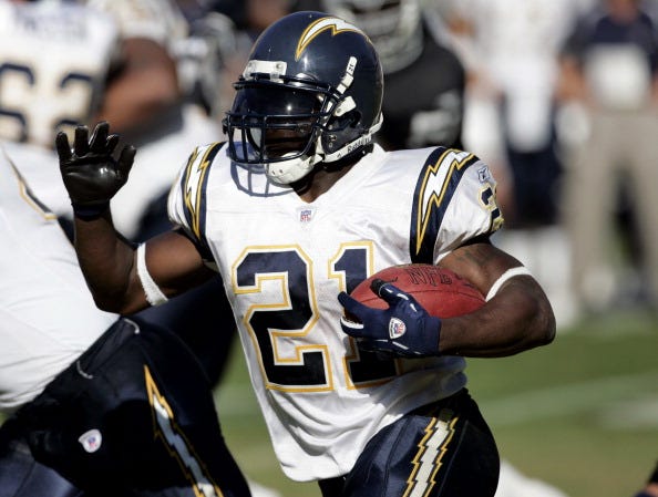 LaDainin Tomlinson rushes with the Chargers.