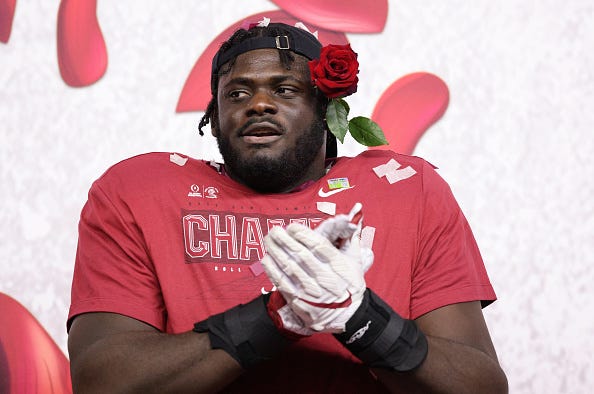 Alabama OT Alex Leatherwood celebrates the Rose Bowl.