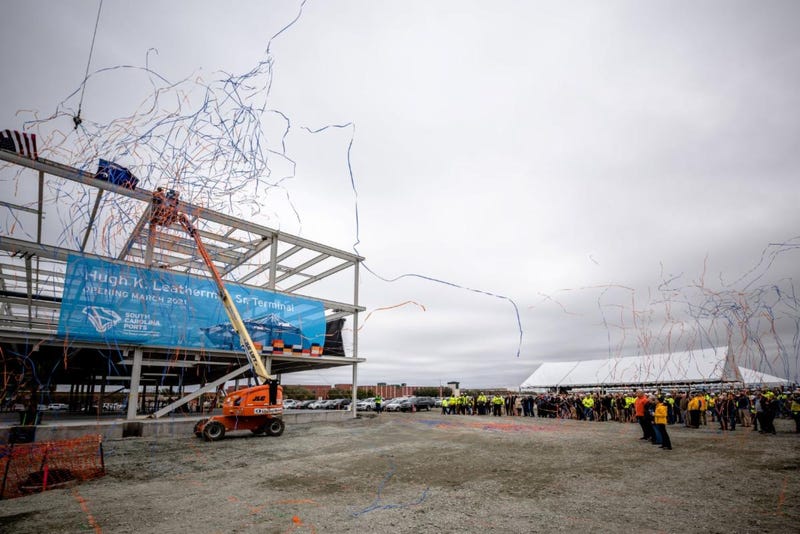 S.C. Ports COO Barbara Melvin (from left), Sen. Hugh K. Leatherman Sr., Jean Leatherman and S.C. Ports CEO Jim Newsome look on as the steel beam is placed on the new operations building at the Hugh K. Leatherman Sr. Terminal.