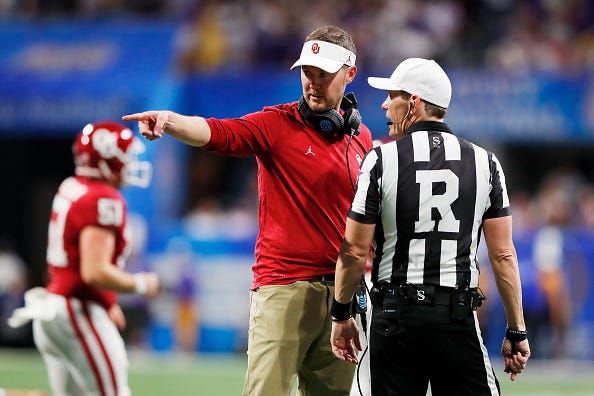 Oklahoma head coach Lincoln Riley argues with an official.