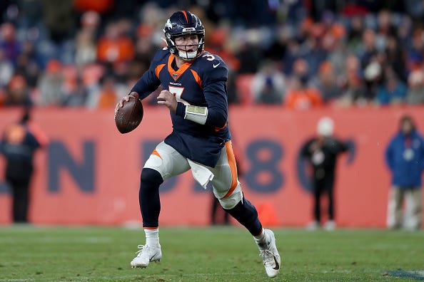 Broncos QB Drew Lock looks to make a play.