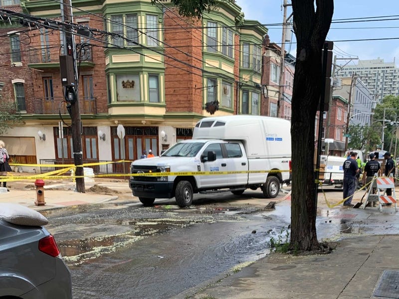 Crews work to get a water main break at Sixth and Bainbridge Streets under control.