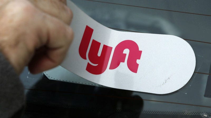 Lyft sticker applied to the rear window so a car