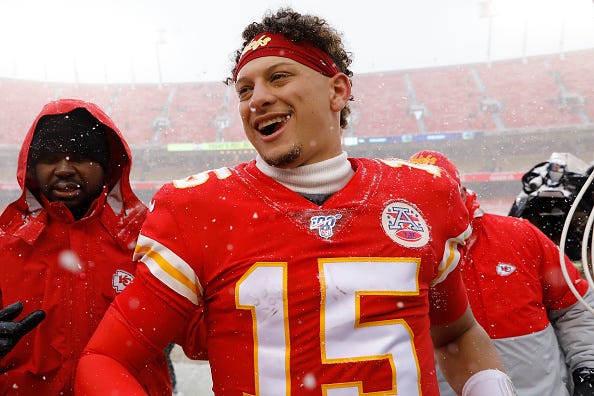 Patrick Mahomes celebrates a Chiefs win in the snow.