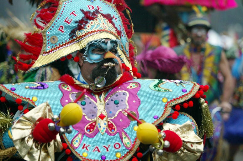 A man in a bold costume for Mardi Gras