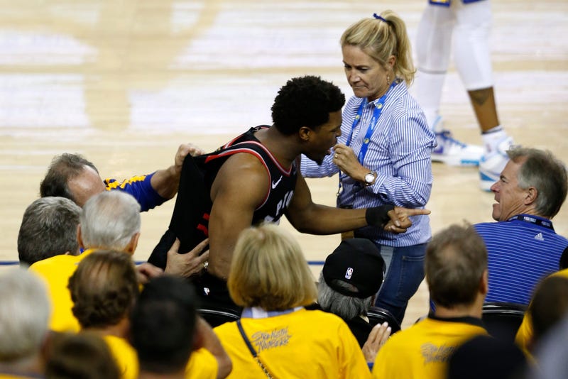 shirt) after Lowry chased down a loose ball in the second half against the Golden State Warriors during Game Three of the 2019 NBA Finals at ORACLE Arena on June 05, 2019 in Oakland, California.