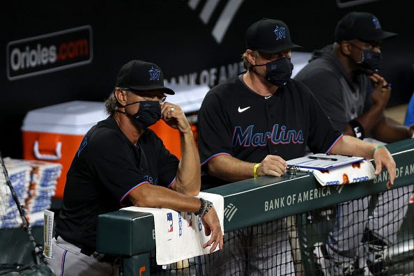 Dan Mattingly watches from the Marlins dugout