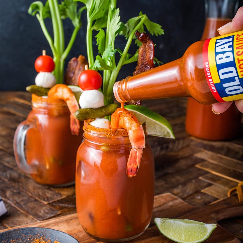 old bay hot sauce dripping in a bloody mary