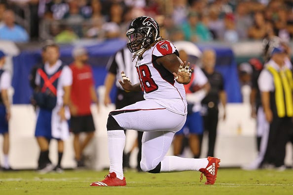Takkaris McKinley celebrates a sack against the Eagles.
