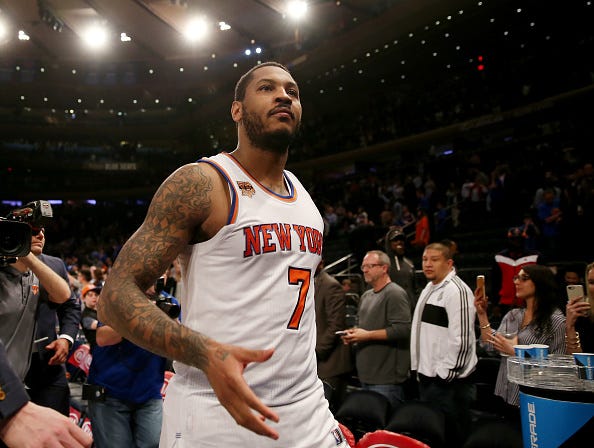 Carmelo Anthony walks off the court at Madison Square Garden.