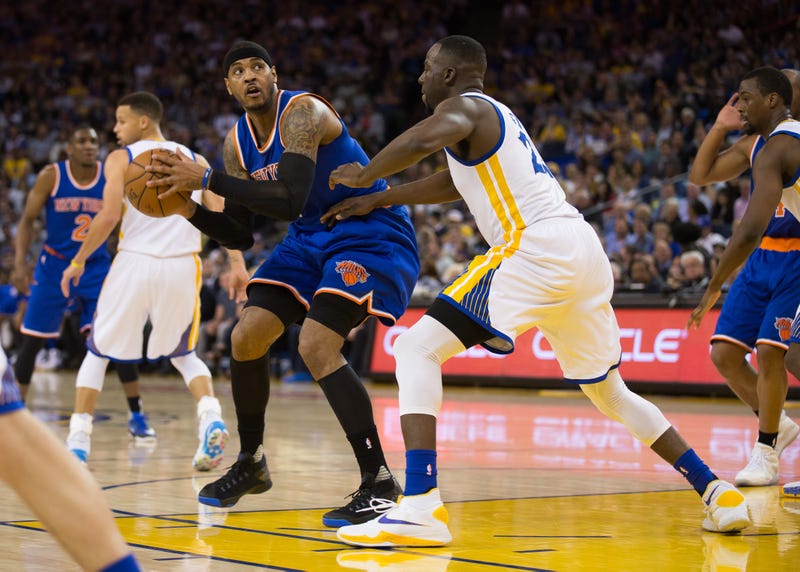 Carmelo Anthony looks to make a play on Draymond Green.