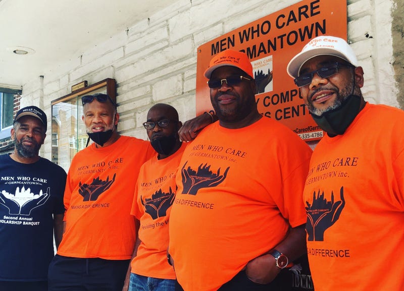 Joe Budd and George Waters (from right) with fellow members of Men Who Care of Germantown.