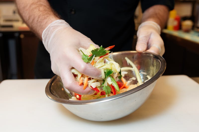 A metal bowl with Asian slaw