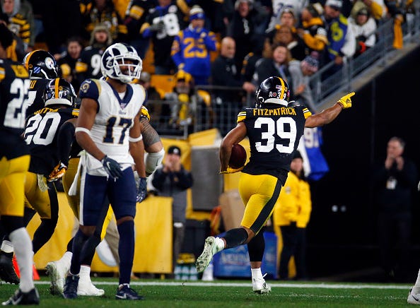 Steelers' Minkah Fitzpatrick returns an interception for a touchdown.