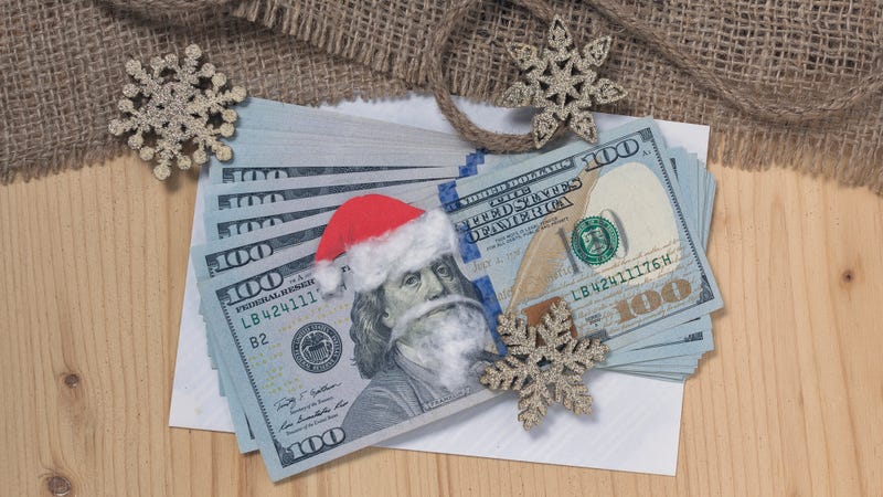 $100 bills wearing a Santa hat and beard