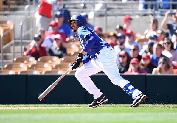 Mookie Betts picks up a hit for the Dodgers in spring training.