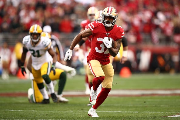 Raheem Mostert runs through the Packers defense in the NFC Championship Game.
