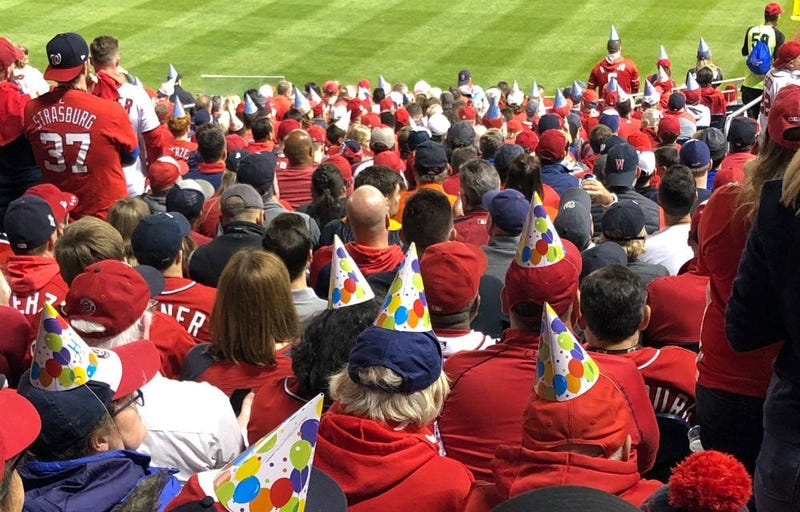 Nationals fans wear birthday hats for Juan Soto at Game 3 of the World Series at Nats Park.