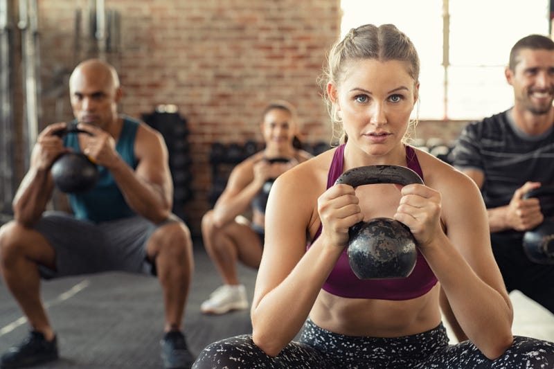 A woman works out in a fitness class