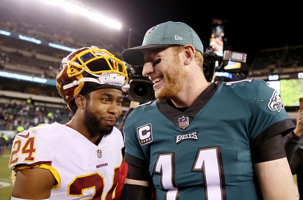 Redskins CB Josh Norman greets Carson Wentz after a game.