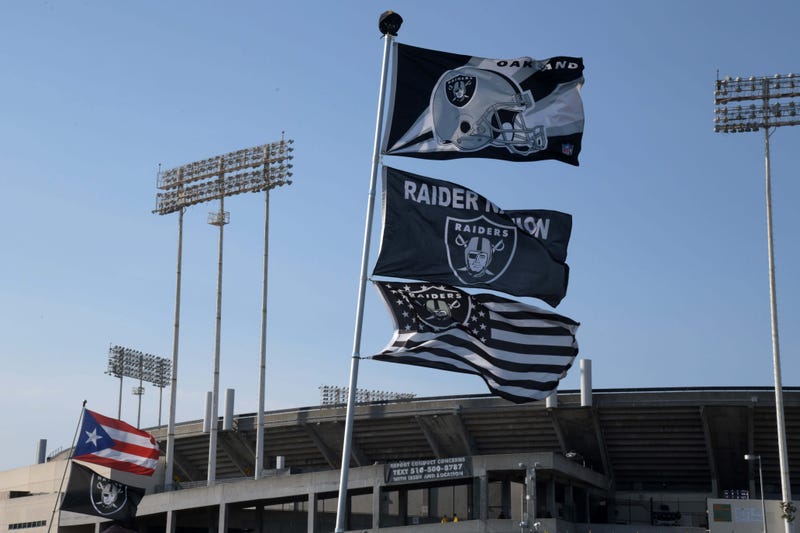 Flags wave outside of Oakland Alameda County Coliseum.