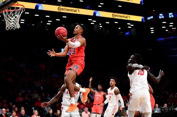 Isaac Okoro flies to the basket during a game with Auburn.