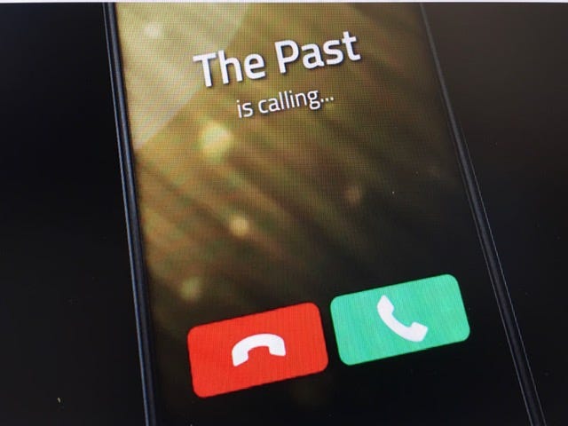 old cell phone with message "the past is calling"