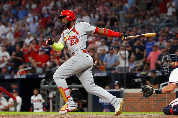 Marcell Ozuna rips a line drive against the Braves.