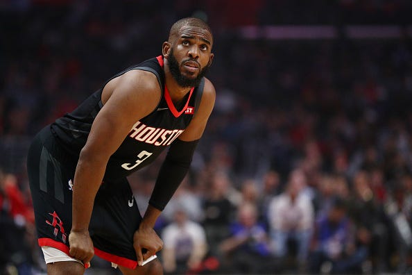 Chris Paul looks on during a game with the Rockets.