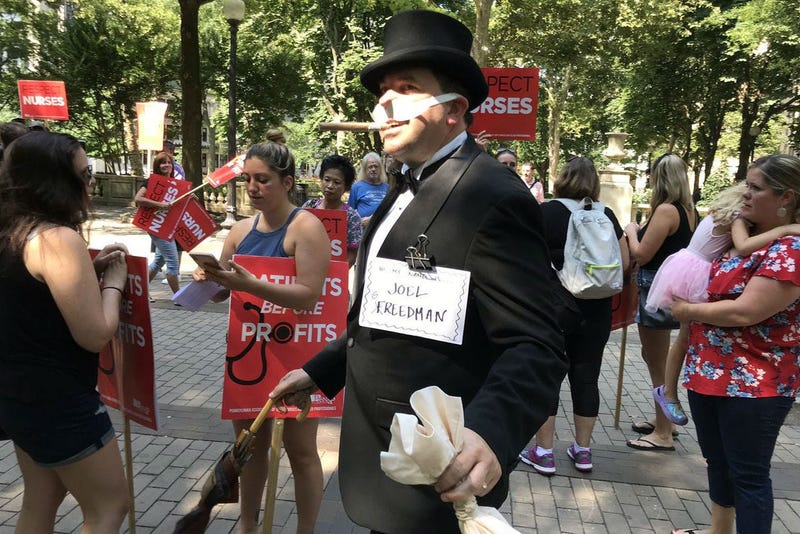 Someone dressed as "Uncle Pennybags" from the board game Monopoly marched with the Hahnemann University Hospital employees.