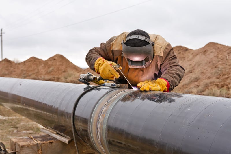 Welder works on pipeline