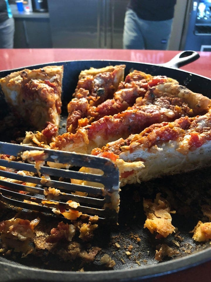 deep dish pizza sliced