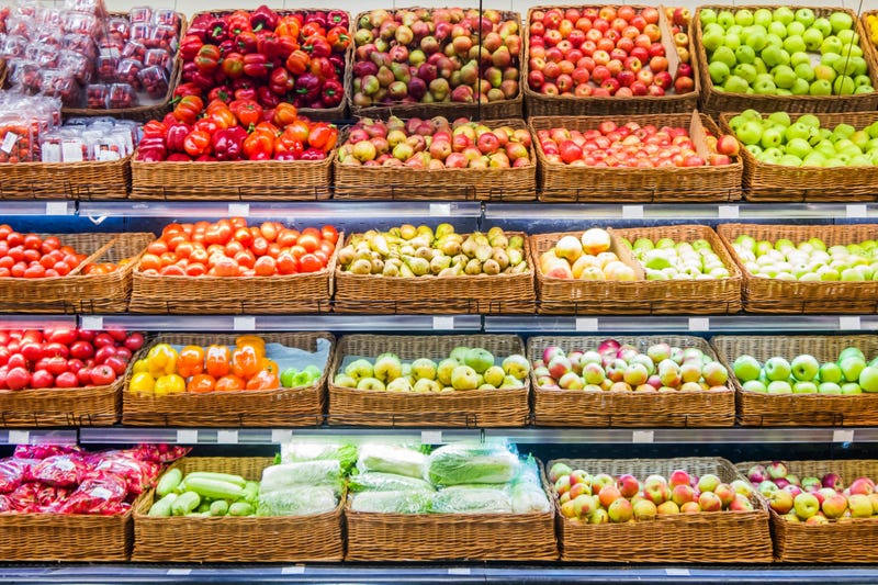 Fresh fruits and vegetables on shelf in supermarket