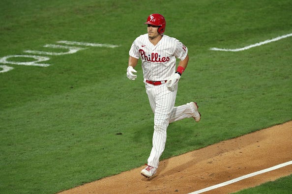 J.T. Realmuto jogs into home after hitting a home run for the Phillies.