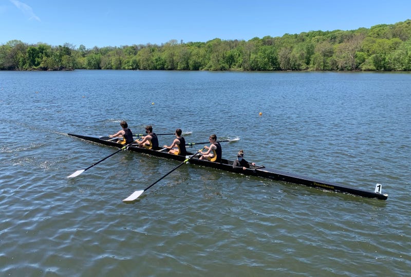 A team of high school rowers competes in the Philadelphia Scholastic Rowing Association City Championship on the Schuylkill River Saturday.