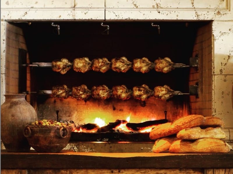 Chicken cooking in rotisserie oven at Kokkari Estiatorio in San Francisco.