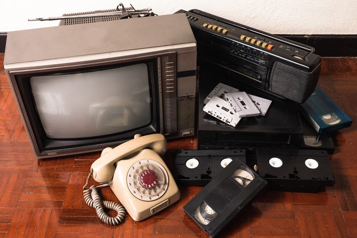 Retro phone, VCR, old tube TV, VHS cassettes