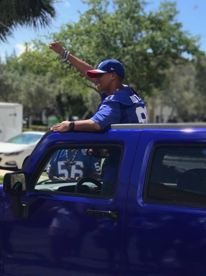 Joshua Rhodes enjoys his Giants-themed Hummer.