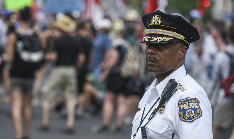 Philadelphia police commissioner Richard Ross Jr. kept an eye as Bernie Sanders supporters march down Broad Street during the Democratic National Convention.