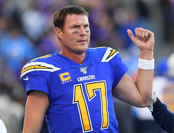 Philip Rivers watches from the Chargers sideline.