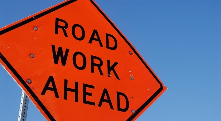 road work ahead sign on highway
