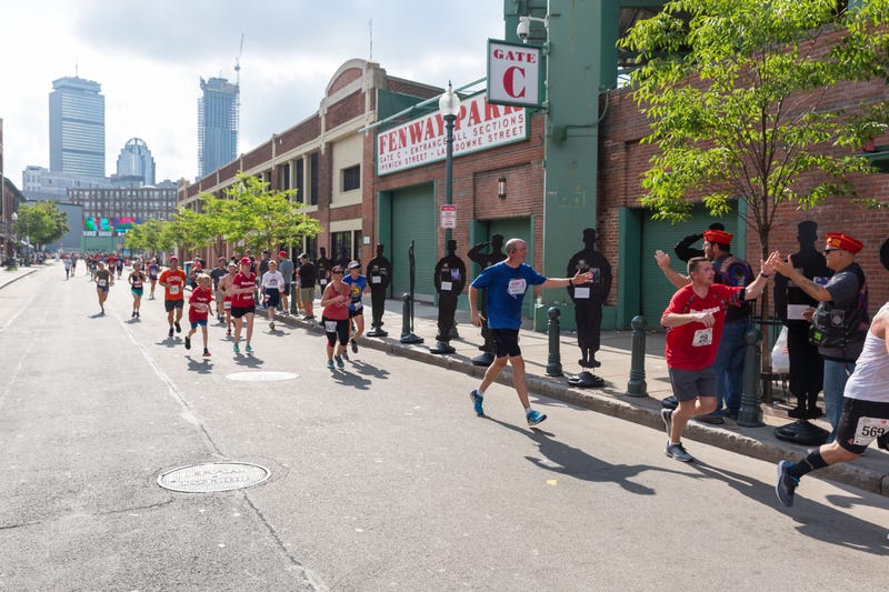Runners take part in the Run To Home Base fundraiser at Fenway Park
