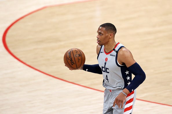Russell Westbrook dribbles up the court during a Wizards game.