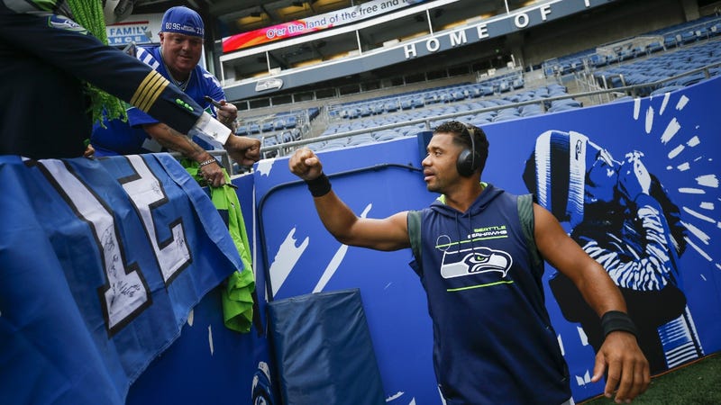 Russell Wilson fist bumps some 12s at Lumen Field