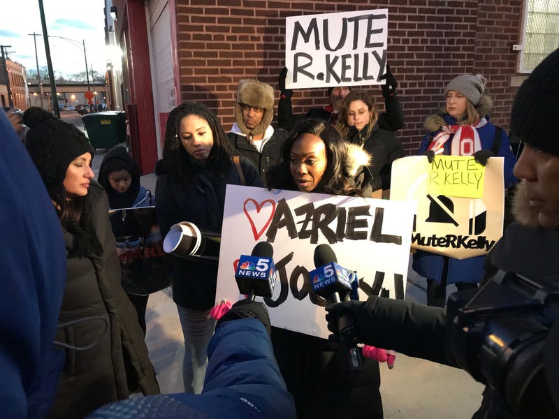 On a night he was facing a protest in his hometown of Chicago, singer R. Kelly appeared to be partying at a local club, where he proclaimed he's not concerned with the controversy brewing around him.
