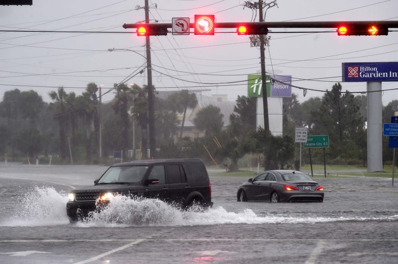 An SUV passes a stalled vehicle in the intersection of U.S. Highway 98 and Santa Rosa Boulevard on Okaloosa Island on Wednesday morning as wind and rain from Hurricane Sally pounded the Emerald Coast. Hurricane Sally