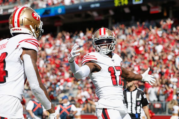 Emmanuel Sanders celebrates a TD in his first game with the 49ers.