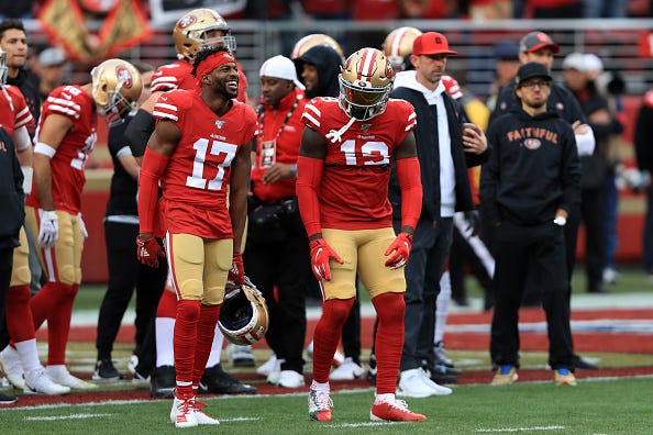 Emmanuel Sanders and Deebo Sanders share a laugh before a 49ers game.