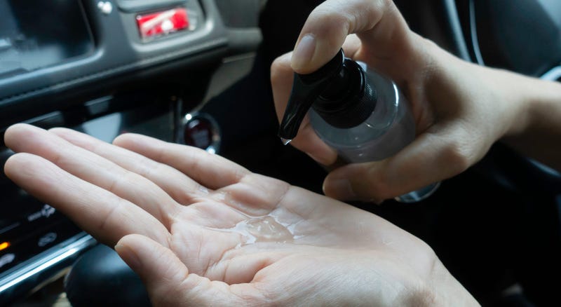 Close-up driver washing hands with alcohol gel to prevent infection coronavirus covid-19.